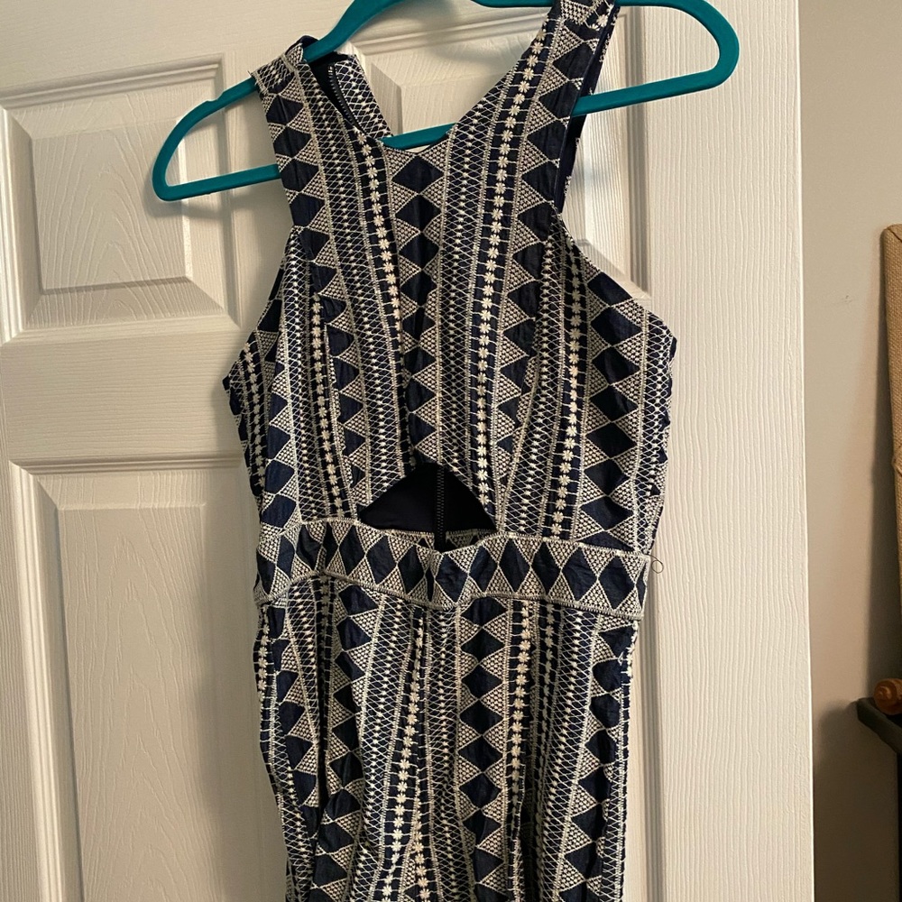 Beautiful cut out navy and ivory and romper!